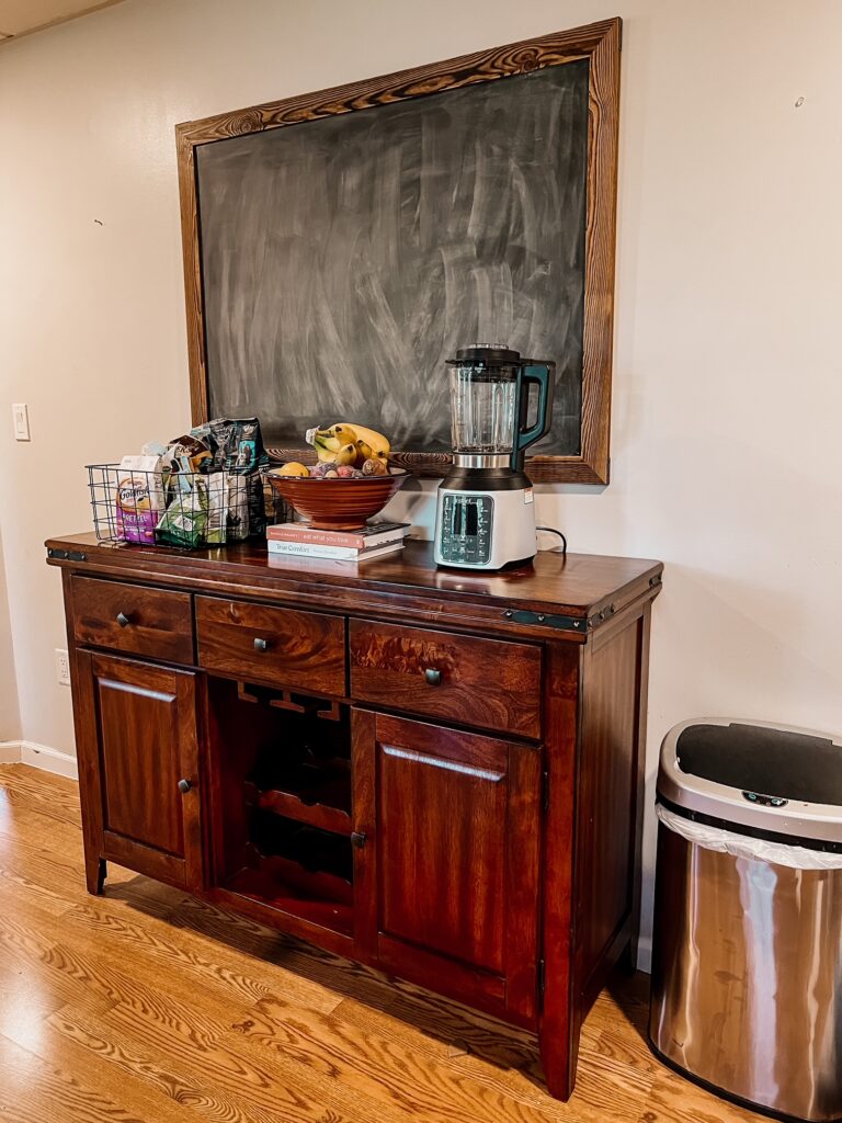 Kitchen Hutch for organization with chalkboard on the wall